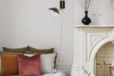 a gorgeous Parisian bedroom with a faux fireplace