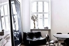 a lovely space with a black loveseat