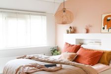 A cute bedroom with a pracrical headboard