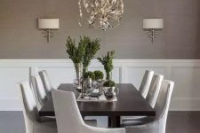 a stylish dining space with a grasscloth wallpaper