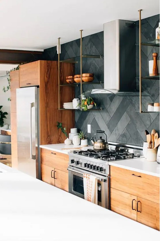 a modern rustic kitchen with stained flat panel cabinets, white stone countertops, a herringbone tile backsplash, suspended open shelves