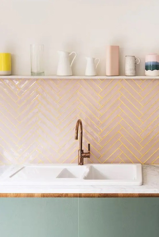 a pink chevron clad tile backsplash with neon yellow grout adds a bold touch to the kitchen