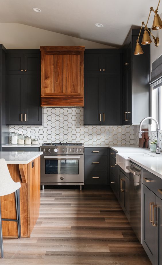 a soot kitchen with a white hex tile backsplash, a rich-stained wooden hood and kitchen island plus white countertops