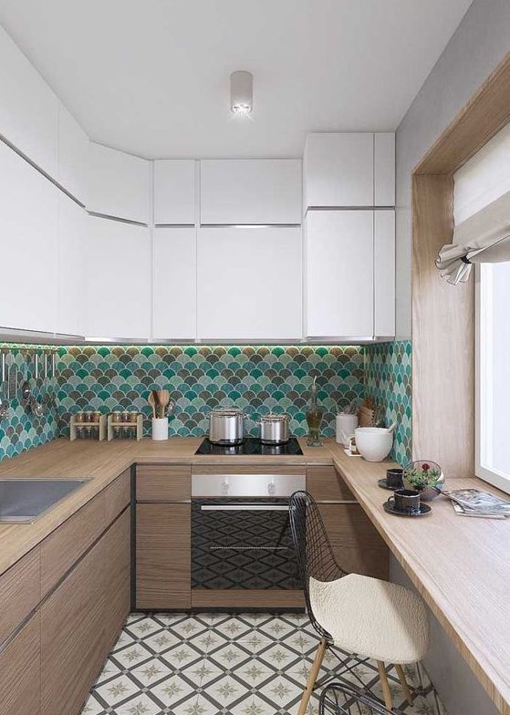 A two tone kitchen with white and stained cabinets, a bright turquoise, green and brown scallop tile backsplash