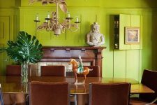 a unique and eclectic space with chartreuse walls and a ceiling, a stained table and brown chairs, a faux fireplace and decor