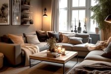 an earthy living room with taupe walls, a grey sectional, some pillows, a coffee table and open shelves