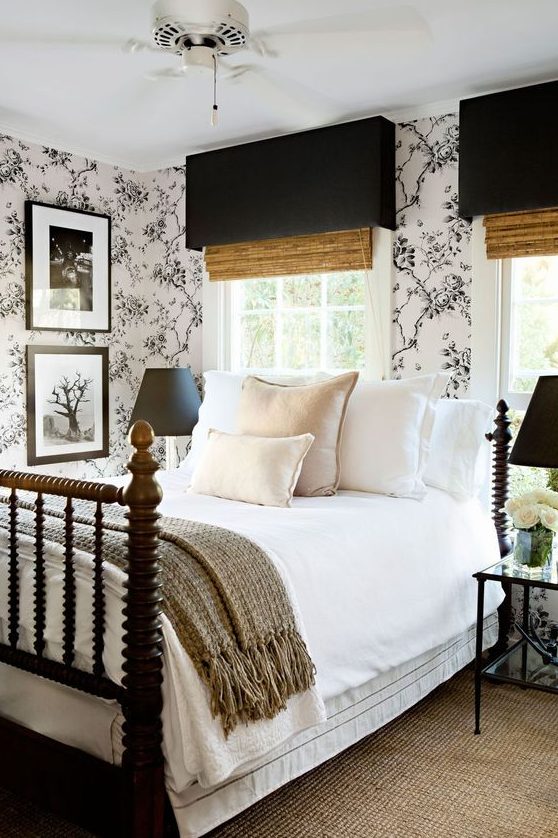 an elegant and stylish modern bedroom in a monochromatic color scheme with black and white floral wallpaper and shades, black lamps