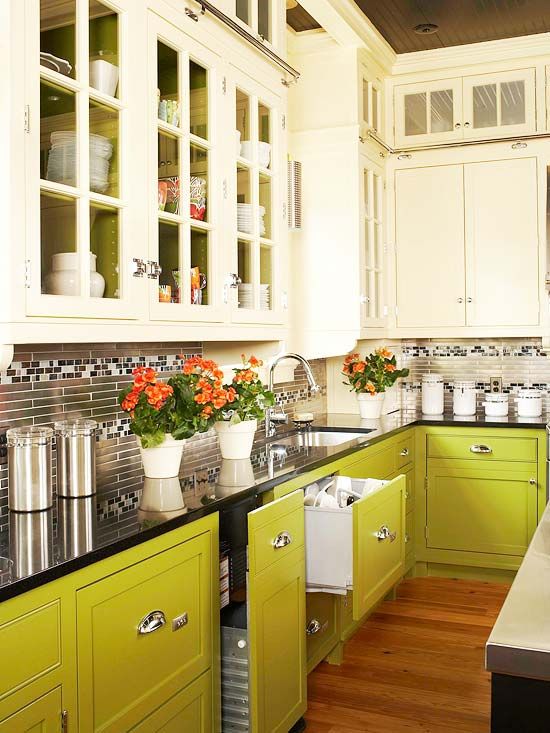 An eye catchy creamy and chartreuse kitchen with a skinny tile backsplash and a black countertop is a cool and creative idea
