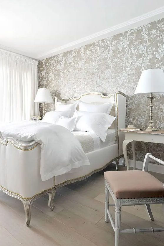 elegant grey wallpaper with a floral print, vintage white furniture and lamps for a refined and chic bedroom
