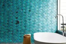 gorgeous turquoise fishscale tiles add color and texture and make a statement in this bathroom