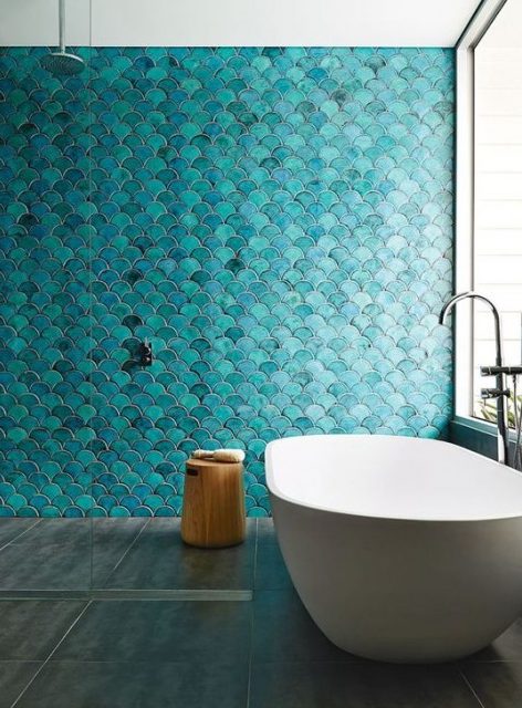 gorgeous turquoise fishscale tiles add color and texture and make a statement in this bathroom