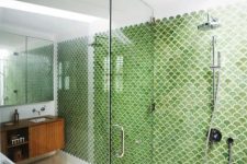 green fishscale tiles define the whole space and stand out a lot in its neutral and calming shades