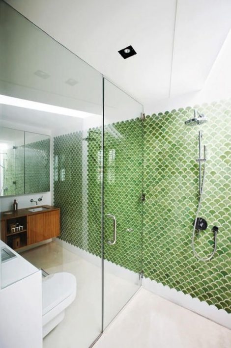 green fishscale tiles define the whole space and stand out a lot in its neutral and calming shades