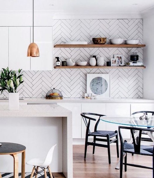 white herringbone tile backsplash adds a contemporary feel to the kitchen