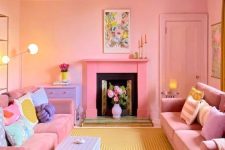 a bright dopamine decor living room with pink walls and a ceiling, pink sofas and pastel pillows, a lilac table and a hot pink fireplace