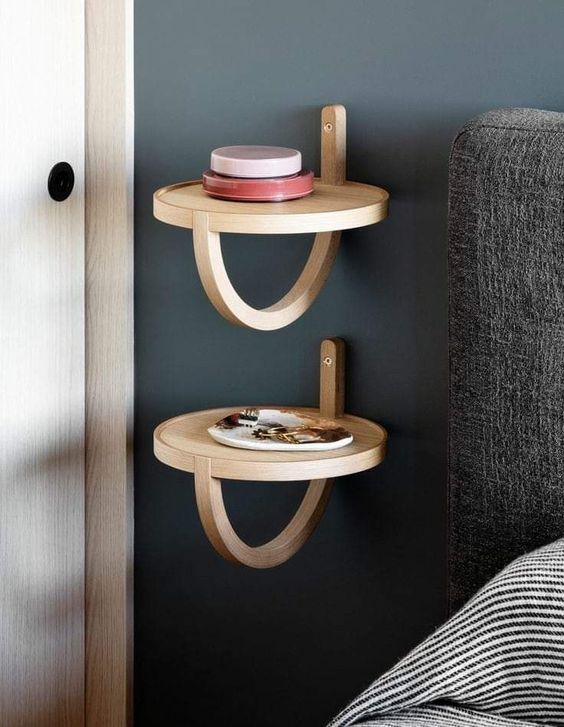 A creative nightstand formed of two round shelves is a cool idea for a small bedroom, it looks eye catchy and adds to the decor