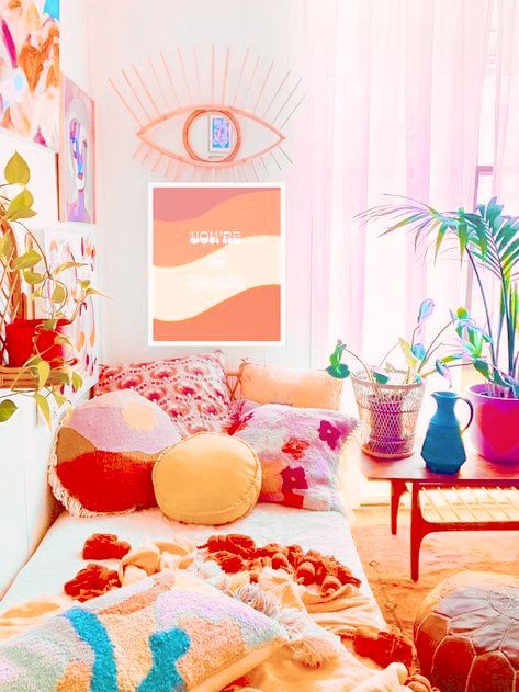 a dopamine decor space with a colorful gallery wall, a daybed with bright pillows, a coffee table with colorful planters