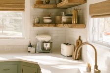 a farmhouse kitchen with stained wooden beams and matcihng corner shelves, with tableware and greenery is lovely