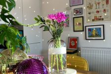a gold and hot pink disco balls are a fun and whimsy centerpieces for any space, they will add light and fun