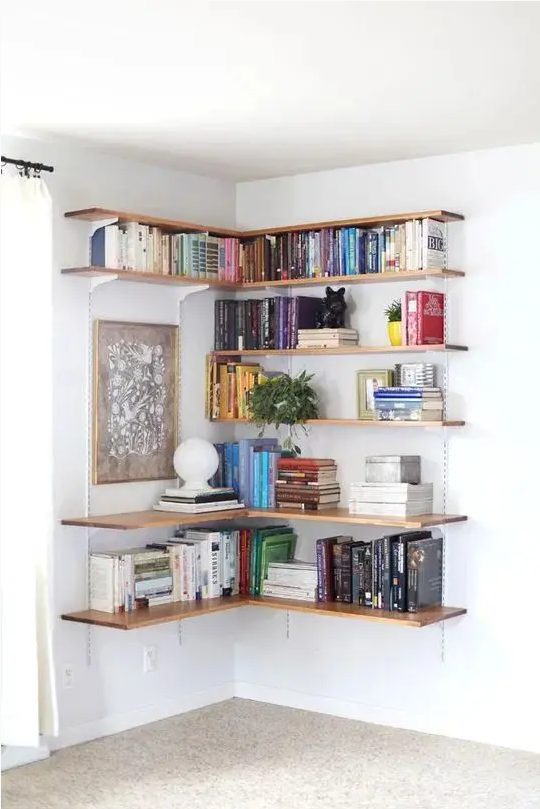 a large open shelving unit covering the corner is a lovely idea to use this space and make the use of it