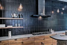 a minimalist stained kitchen with a grey quartz countertop plus a black large scake stacked tile backsplash that takes a whole wall