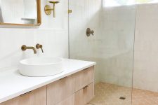 a modern neutral bathroom clad with white Zellgie and scallop terracotta tile, a stained vanity, a shower space and a mirror
