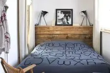 a stylish bedroom with a wooden headboard