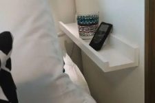 a piece of white ledge is a cool idea for a nightstand if it seems that you have no space for a bedside table