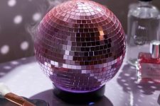 a pink disco ball aroma oil diffuser is a cool decoration for a modern space and it will be your dopamine decor piece