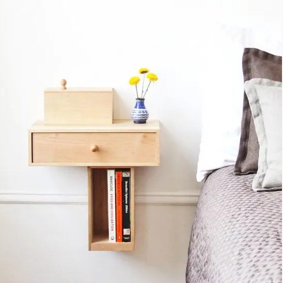 a small drawer unit on the wall is a cool idea for a small bedroom, it will take no floor space