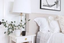 a small white nightstand with a single drawer is a lovely idea for a mid-century modern or farmhouse space