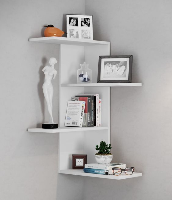 a small white shelving unit with several shelves going different sides are a cool solution for storage and display