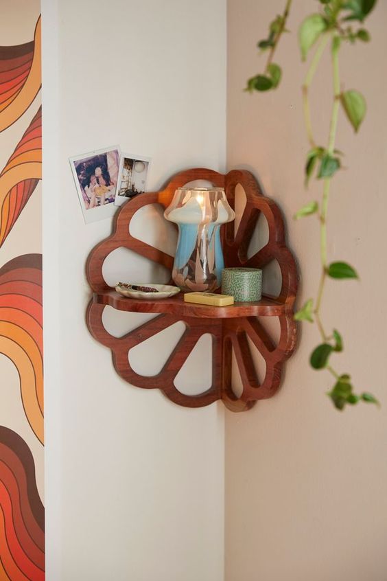 A stained wood flower shaped corner shelf will add coziness and interest to a boho space, add any decor you like