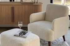 a stylish combo of a white boucle chair and a footrest is a great idea for many rooms and spaces
