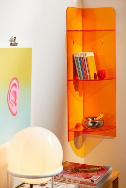 a super bright orange clear acrylic shelving unit will be a bold statement in the interior, it looks very bold