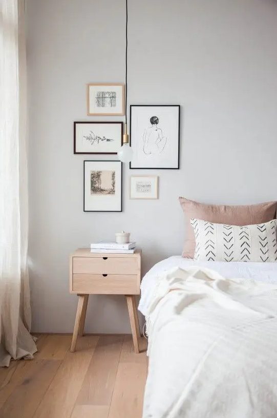 a tiny stained nightstand with two drawers is a lovely addition to a small Scandinavian bedroom