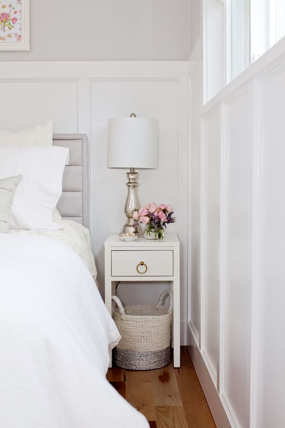a tiny white nightstand with a drawer and a chic ring handle is a lovely idea for a modern bedroom