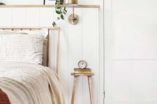 a tiny wooden stool nightstand that can hold just a couple of books and an alaram clock is a cool idea for a tiny bedroom
