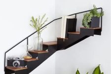 a very creative staircase corner shelf allows you to store and display a lot of stuff and looks awesome