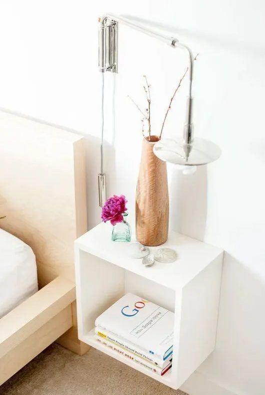 a white open box bedside table is a timeless and stylish idea for any bedroom, it's very space-saving
