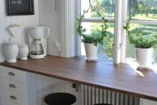 a windowsill used as a breakfast zone, additional drawers for storage