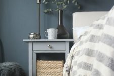 an IKEA Hemnes bedside table hack in elegant grey and with a single metallic knob is a stylish idea