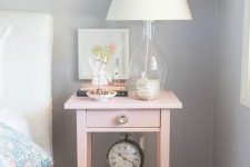 an IKEA Hemnes bedside table hacked in pink and with a metallic knob will add a girlish feel to the space