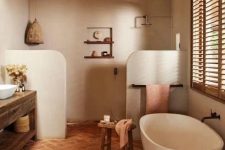 an earthy bathroom with a large shower space, a tub, a terracotta tile floor, a large rough wood vanity and a pendant lamp