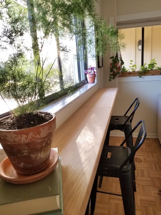 an oak countertop installed as a windowsill is a perfect base for a breakfast bar or a coffee bar at home, add some stools