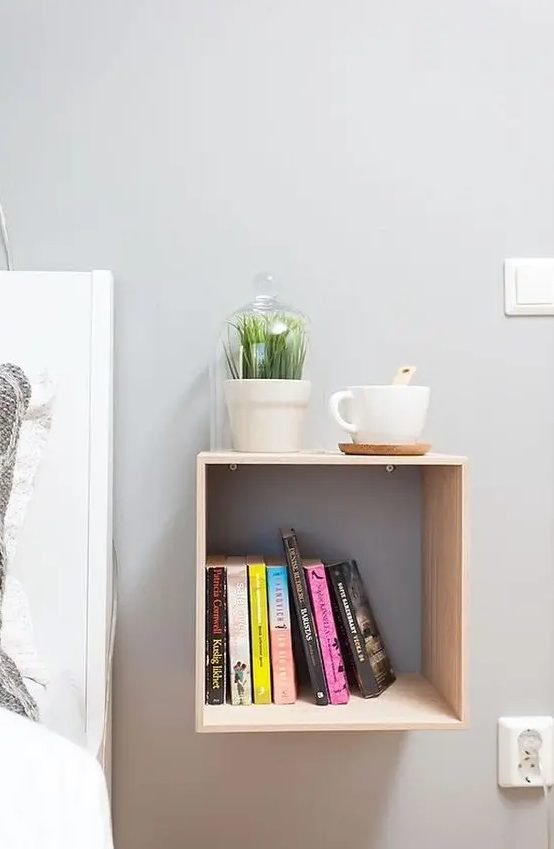 an open cabinet attached to the wall will save space and give your storage space