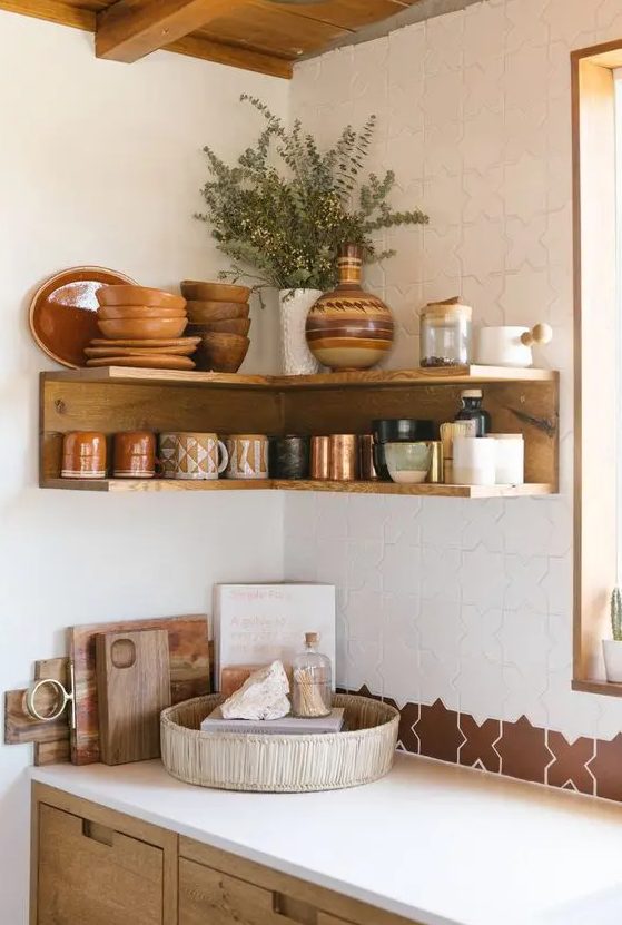 an open stained shelving unit in the corner will save much space for storing things in your kitchen like here