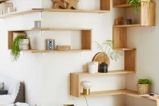 light-stained open and box corner shelves as a whole system with decor, potted plants, are great for a contemporary space