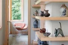 open corner shelves with vases, figurines and other stuff for decor are a great way to show off your collection