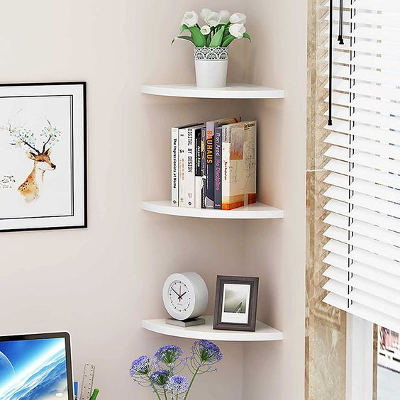 small rounded corner shelves can accommodate some things and decor making maximum of your space
